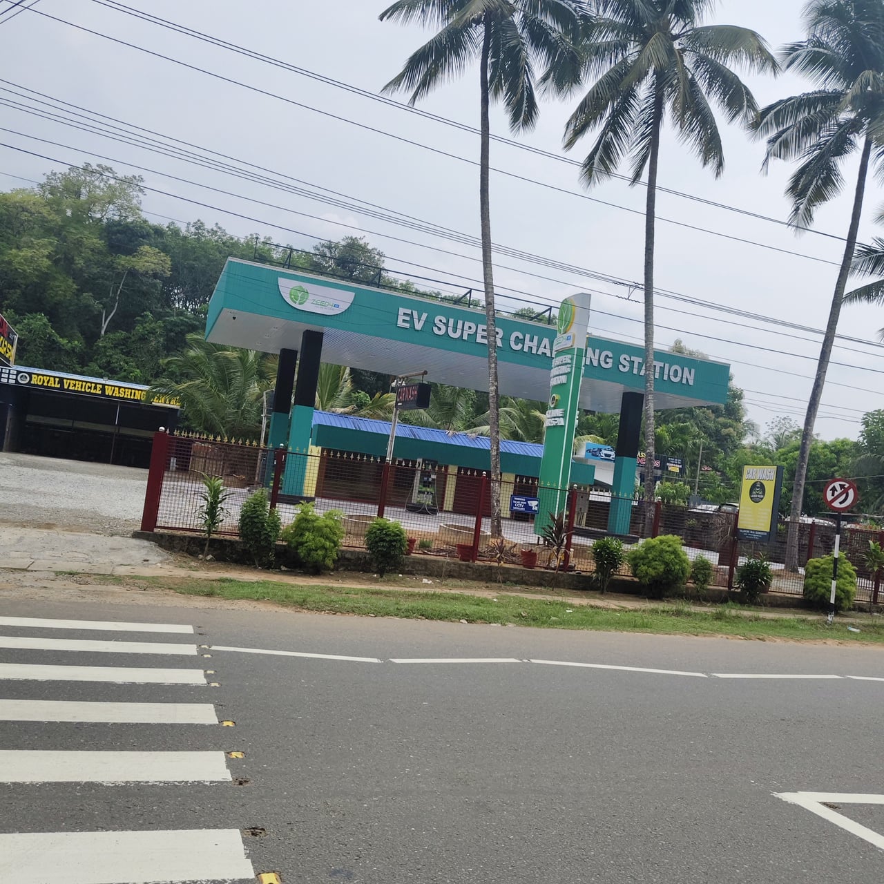 Commercial EV cab plugged into DC fast charger station in Delhi-NCR
